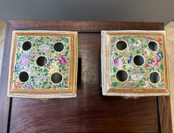 A pair of Chinese Canton famille rose bough pots and covers, 19th C.