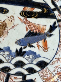 A Japanese Imari dish with carps among waves and clouds, Edo, 17th C.