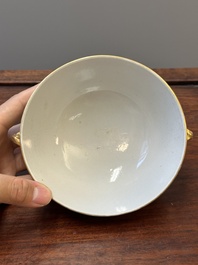 A Chinese Canton famille rose covered bowl and a matching plate, 19th C.