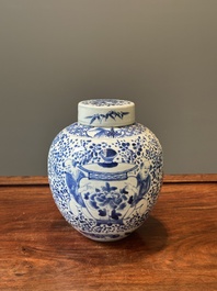 A pair of Chinese blue and white covered vases and three jars, 19th C.