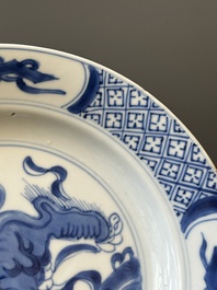 A pair of Chinese blue and white 'Buddhist lion' plates, ding mark, Kangxi