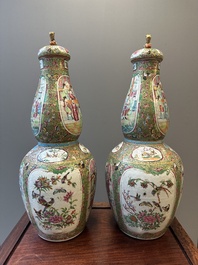 A pair of Chinese Canton famille rose double gourd vases and covers, 19th C.