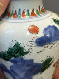 A small Chinese wucai jar with figures in a landscape, Transitional period