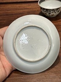 A pair of Chinese grisaille and gilt 'pheasant' cups and saucers, Yongzheng