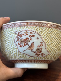 A pair of Chinese iron-red-decorated and gilt bowls with relief design, Kangxi