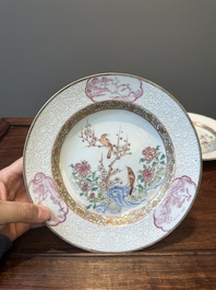 A pair of Chinese famille rose 'magpie and peony' plates with bianco-sopra-bianco rims, Yongzheng