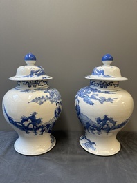 A pair of Chinese blue and white covered vases with figural design, 19th C.