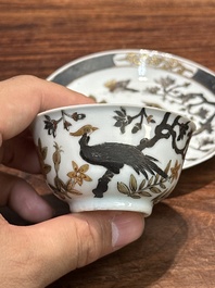 A pair of Chinese grisaille and gilt 'pheasant' cups and saucers, Yongzheng
