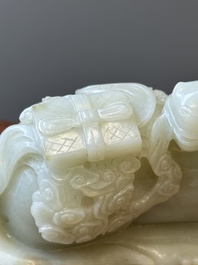 A Chinese celadon jade sculpture of a mythical horse, 18th C.