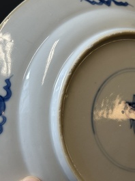 A pair of Chinese blue and white 'Buddhist lion' plates, ding mark, Kangxi