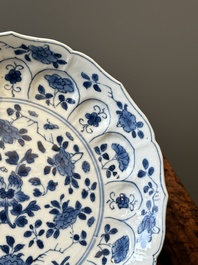 A pair of Chinese blue and white 'Mongolian hunting scene' plates and a pair of plates with floral design, Chenghua and Kangxi mark, Kangxi