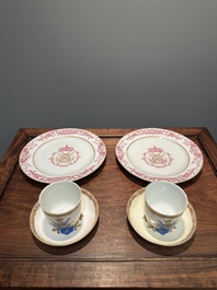 A pair of monogrammed Chinese puce-enamelled plates and a pair of armorial cups and saucers, Yongzheng/Qianlong