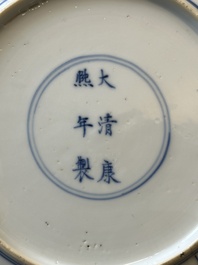 A pair of Chinese blue and white 'Mongolian hunting scene' plates and a pair of plates with floral design, Chenghua and Kangxi mark, Kangxi