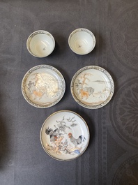 A pair of Chinese grisaille and iron-red 'buffalo' cups and saucers and a 'rooster' saucer, Yongzheng