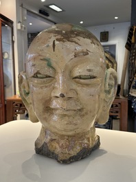 An imposing Chinese sancai glazed stoneware head of a monk, Yuan/Ming