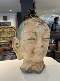 An imposing Chinese sancai glazed stoneware head of a monk, Yuan/Ming