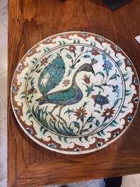 An exceptional polychrome Iznik pottery 'peacock' dish, Turkey, last quarter 16th C.