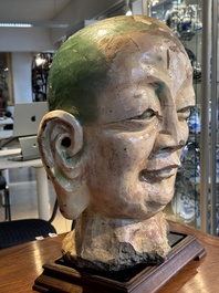 An imposing Chinese sancai glazed stoneware head of a monk, Yuan/Ming