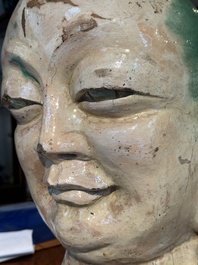 An imposing Chinese sancai glazed stoneware head of a monk, Yuan/Ming