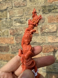 A Chinese red coral figure of a standing lady with a flower basket, 19/20th C.