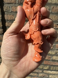 A Chinese red coral figure of a fisherman on wooden stand, 19/20th C.