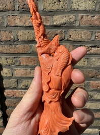 A Chinese red coral figure of a fisherman on wooden stand, 19/20th C.