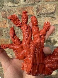 A Chinese red coral group of ladies with playing children on wooden stand, 19/20th C.