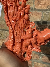 A large Chinese red coral group of Shoulao surrounded by children and a ram on wooden stand, 19/20th C.