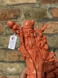 A large Chinese red coral group of Shoulao surrounded by children and a ram on wooden stand, 19/20th C.