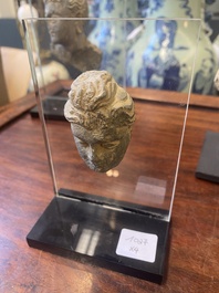 A Gandhara fragment of a stucco Sakyamuni head and a grey schist Bodhisattva head, 1/4th C.