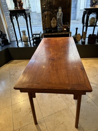 A Chinese huanghuali wooden two-drawer recessed-leg table, 19/20th C.