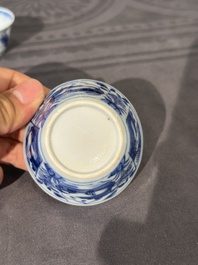 Thirteen Chinese blue and white saucers and twelve cups with figural design, Kangxi/Yongzheng