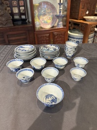 Thirteen Chinese blue and white saucers and twelve cups with figural design, Kangxi/Yongzheng