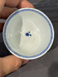 Thirteen Chinese blue and white saucers and twelve cups with figural design, Kangxi/Yongzheng