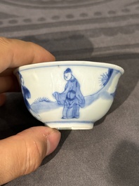 Thirteen Chinese blue and white saucers and twelve cups with figural design, Kangxi/Yongzheng