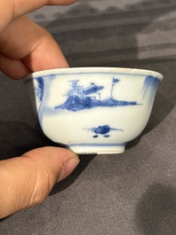 Thirteen Chinese blue and white saucers and twelve cups with figural design, Kangxi/Yongzheng