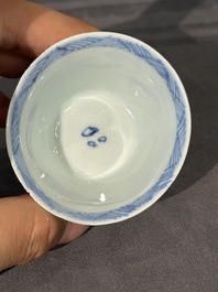 Thirteen Chinese blue and white saucers and twelve cups with figural design, Kangxi/Yongzheng