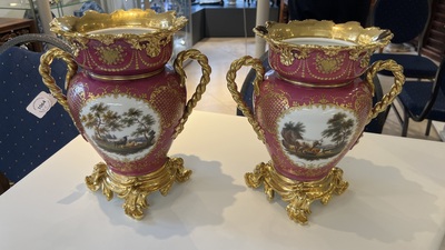 A pair of French parcel-gilt polychrome pink-ground porcelain potpourri vases, Jacob Petit, Paris, 19th C.