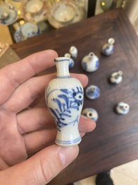 Thirteen Chinese blue and white miniature vases with floral design, Kangxi