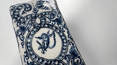 A rectangular Dutch Delft blue and white teacaddy and cover, 18th C.