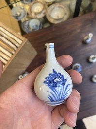 Thirteen Chinese blue and white miniature vases with floral design, Kangxi