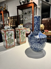 A Chinese blue and white bottle-shaped 'lotus scroll' vase and a pair of square famille verte flasks and covers, 19th C.