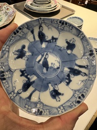 13 Chinese blue and white cups and 14 saucers with figural and dragon design, Kangxi/Yongzheng