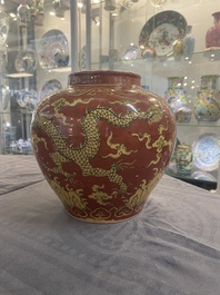 A Chinese cream-glazed vase and two 'dragon' vases, Jiajing and Wanli mark, 19/20th C.