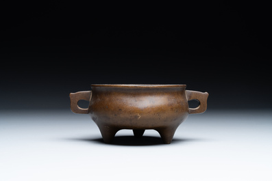 A Chinese bronze censer and stand, Xuande mark, 17th C.