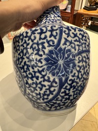 A Chinese blue and white bottle-shaped 'lotus scroll' vase and a pair of square famille verte flasks and covers, 19th C.