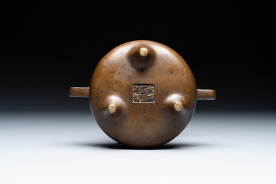 A Chinese bronze censer and stand, Xuande mark, 17th C.