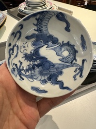 13 Chinese blue and white cups and 14 saucers with figural and dragon design, Kangxi/Yongzheng