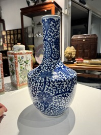 A Chinese blue and white bottle-shaped 'lotus scroll' vase and a pair of square famille verte flasks and covers, 19th C.