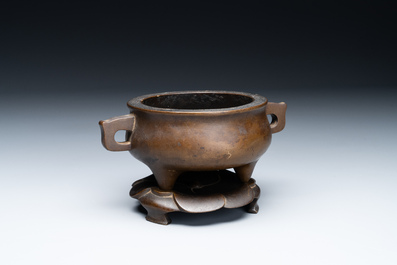 A Chinese bronze censer and stand, Xuande mark, 17th C.